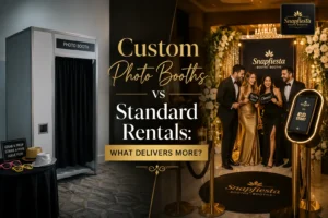 Split image: Left side shows a plain photo booth with props. Right side shows four people posing in an elegant photo booth setup with gold decor. Text reads, “Custom Photo Booths vs Standard Rentals: What Delivers More?”.